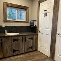 Bathroom vanity alternate angle with window, reclaimed wood, and stone