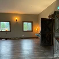 Studio angle with wooden cabinet detail and warm sconce lighting